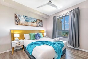 The primary bedroom features a sumptuous queen-sized bed and a full ensuite.