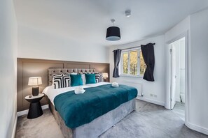 Bedroom 1 with comfortable zip link beds which is configured as two single beds by default or can be zipped together to form a king size bed upon request