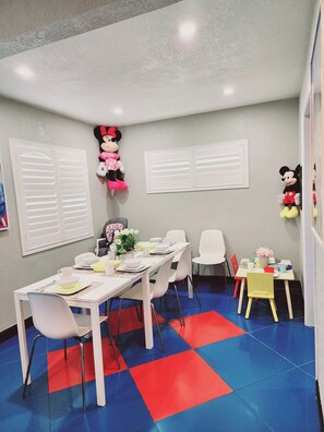 adult and children's dining table including high chair