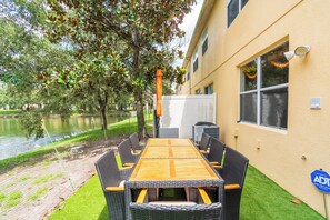 Dine outdoors with peaceful lake views right from your private patio.