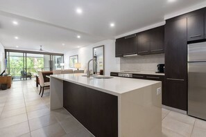 Open plan living and dining is drenched in natural light.