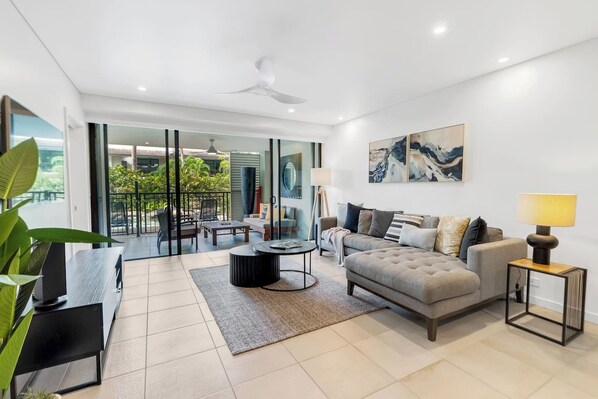 Find serene respite from the daily grind in the comfortably furnished living room with direct access to a refreshing outdoor balcony.