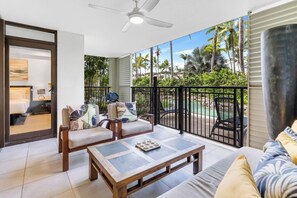 Escape from the hustle and bustle to a relaxing retreat with a patio that boasts pool views.