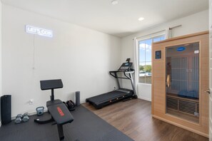 Modern fitness room with essential equipment