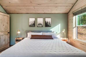 This bedroom offers a King Size bed, a smart TV, a closet, and a dresser.