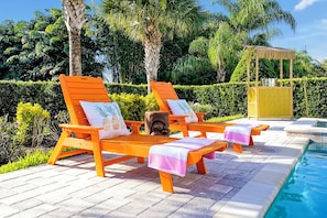 Plush sun loungers by the pool