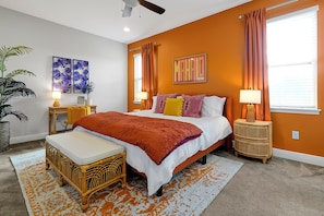 Bedroom with plush king bed and dedicated workspace