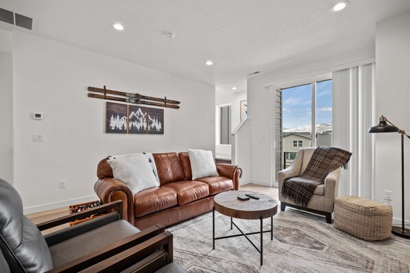 Lovely living room with modern decor and mountain views..