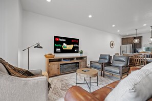 Open concept design from kitchen, dining area to living room.