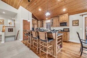 Kitchen: Well-equipped kitchen, drip coffee maker, Crockpot, kitchen island with 4 barstools, ample counter and cabinet space