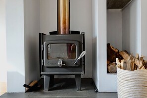 Indoor fireplace, timber provided