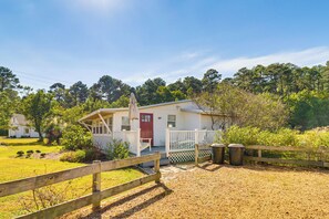 Cottage Exterior | Furnished Deck | Charcoal Grill