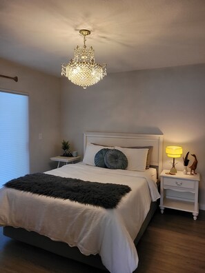 main level queen bed w/ slider doors to deck