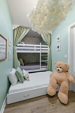 Your 3rd guest room / kids room features two twin bunk beds and a pull out floor mattress for larger groups.