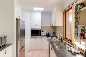 Kitchen with fridge, stove, oven, dishwasher and more