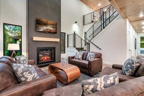 Enjoy modern elegance with a stylish fireplace and scenic views! Perfect for relaxation!