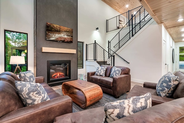 Enjoy modern elegance with a stylish fireplace and scenic views! Perfect for relaxation!