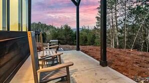 The back patio just off of the pool room will allow you to rock your cares away while listening to our serene nature sounds.