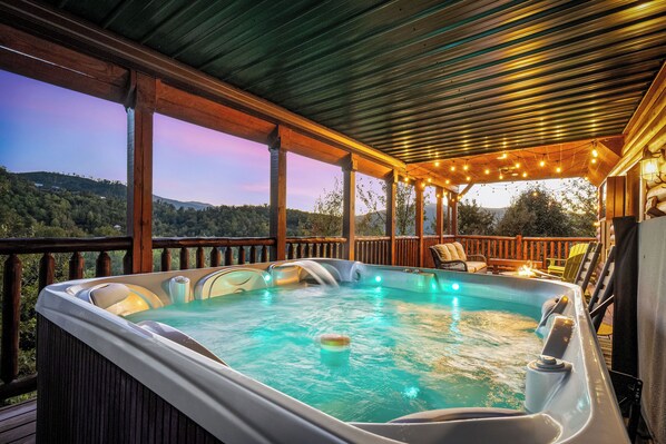 Soak your cares away in the private hot tub on the deck!