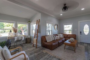 Catch up on work in our cozy office nook with a view. Or kick back and relax on the sofa after a day of adventuring around Sonoma County. Opposite the sofa, is a smart tv.