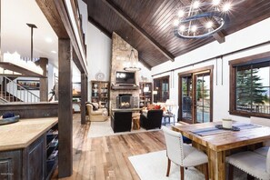 Modern Rustic Kitchen – High-end appliances, exposed beams, and a spacious island blend elegance with function.
