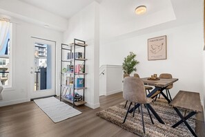 Enjoy meals in the cozy dining area that comfortably seats up to 7 guests, ideal for family gatherings or sharing a meal with friends after a day of exploring & explore our charming mini library, where you can pick a book to enjoy during your stay. If you