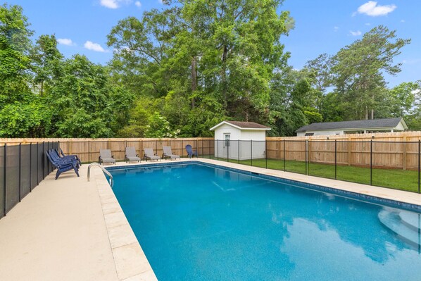 Relax at your private in-ground pool with LIfesaver brand safety fence!