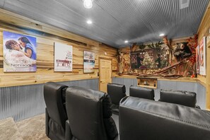 Recline back + enjoy your favorite movie in the home theater.