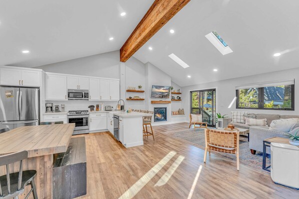Main Living Space: Bright and open layout, living room, kitchen, dining room, gas fireplace
