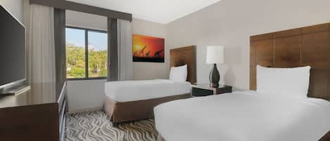 Unit with two double beds. Exact unit will be assigned upon arrival. Views, colors, and decor may vary.
