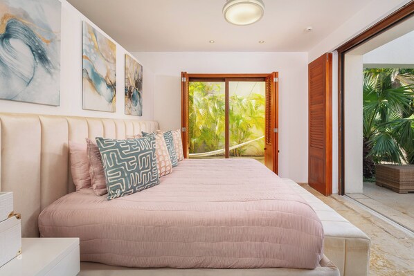 Master Bedroom Suite featuring a luxurious King bed, a private en-suite bathroom