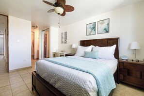 Master suite with a plush queen bed, full bath with his and her sinks and a TV.
