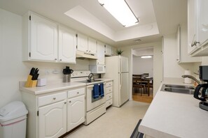 Galley kitchen has everything you may need.