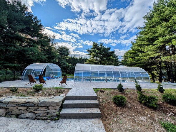 Indoor/ outdoor pool partially open (surrounding pool fence not shown)