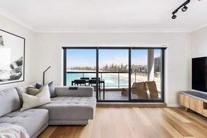 Floor-to-ceiling views flow to a spectacular oceanfront terrace with gas BBQ