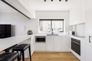 Designer kitchen with coffee machine,  microwave and dishwasher