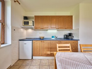 Wood, Interior Design, Flooring, Floor, Ceiling, Furniture, Room, Cabinetry, Major Appliance, Kitchen