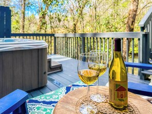 Unwind in the hot tub with a glass of local wine, listening to the soothing waterfall sounds of the creek after a day of hiking and adventure