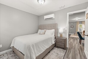 Comfortable bedroom with soft bedding and calming vibes. 
