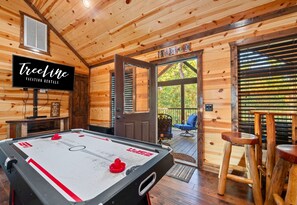 Challenge your friends or family to a lively game of air hockey in the game room. It’s a fun way to bring out a little friendly competition and keep everyone entertained indoors.