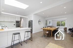 Open plan living with internal dining for eight and breakfast bar for two 