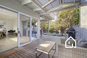 Undercover wraparound deck with café blinds and BBQ.  