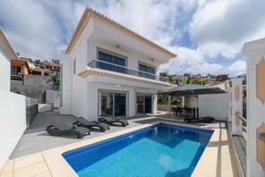 An Exterior View Of Atlantic Sunrise Villa In Funchal By Ourmadeira