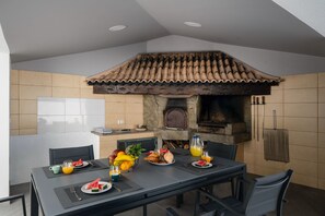 Enjoy Alfresco Meals In The Covered Barbecue Area Of Atlantic Sunrise Villa In Funchal