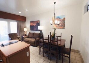 Living and dining area. Exact unit will be assigned upon arrival. Views, colors, and decor may vary.