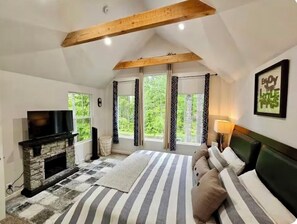 Master bedroom suite with fireplace. 