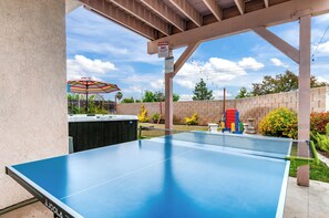 Outdoor Seating, Ping-Pong Table, Giant Connect 4, and Cornhole 