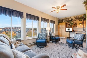 Spacious All-Weather Sunroom, Featuring a Wet Bar, Cable TV, Swivel Rocking Chairs, and a Sleeper Sofa- All with a Great Golf Course View!