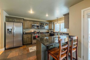 Kitchen: Well-equipped kitchen, updated appliances, drip coffee maker, kitchen island w2 barstools
