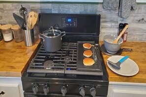 Make pancakes or waffles for breakfast if you like. Recipe on the wall.